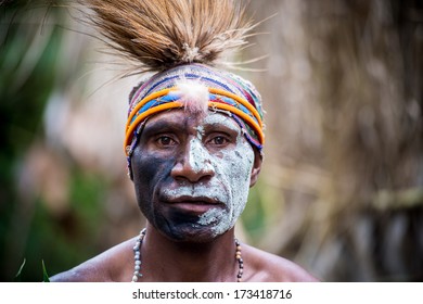 PAPUA NEW GUINEA - OCTOBER 25: A Kaia Tribe Member In Traditional Clothing And Face Paint In Kaip Village In Papua New Guinea On October 25, 2013.