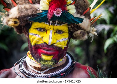 PAPUA NEW GUINEA - OCTOBER 30: The Men Of The Huli Tribe In Tari Area Of Papua New Guinea In Traditional Clothes And Face Paint On October 30, 2013. 