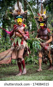 PAPUA, NEW GUINEA - OCTOBER 30: The Men Of The Huli Tribe In Tari Area Of Papua New Guinea In Traditional Clothes And Face Paint On October 30, 2013. 