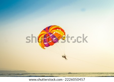 Para sailing in the Goa sky