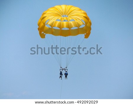 para sailing over pristine turquoise water