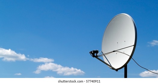 Parabolic Antenna On A Background Of Blue Sky