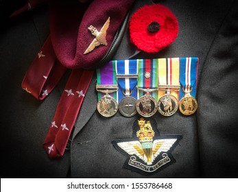 Parachute Regiment Logo Cap Badge, Tie, Beret, Medals Along With A Red Poppy For Remembrance. Taken On 11/08/2019. Uk.