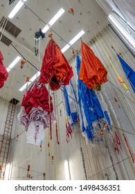 Parachutes Hanging From Ceiling After Being Checked And Waiting For Folding And Packing Prior To Taking Next Fire Jumper Out To Fight A Wildfire.