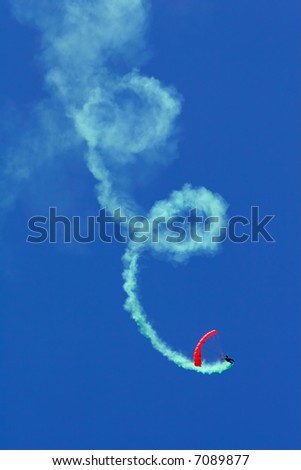 Similar – Red plane with propeller flying upward with white smoke