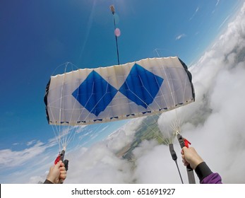 Parachutist Pov Diving Into The Clouds.