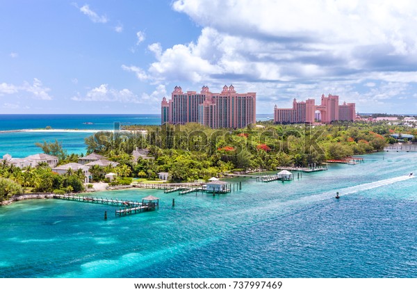 Paradise island with the Atlantis Resort at the\
background, Nassau, Bahamas\
Awesome Atlantis Resort on Paradise\
island in the island of Nassau, in the heart of the Caribbean sea\
in a sunny summer day.