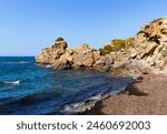 Paradise sea bay with azure water and beach view from coastline trail of Zingaro Nature Reserve Park, between San Vito lo Capo and Scopello, Trapani province, Sicily, Italy.