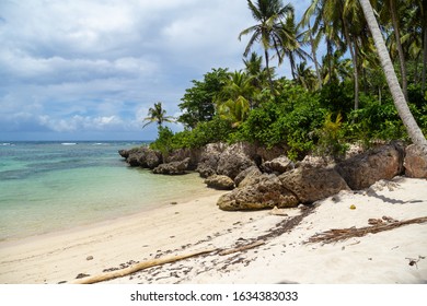 Paradise uninhabited island. Tropical beach between the rocks. Beautiful secluded island. High cliffs on the Caribbean coast. Beautiful Tropical beach in sunny day. - Shutterstock ID 1634383033
