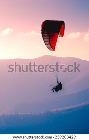 Paraglide in a sky above Carpathian mountains