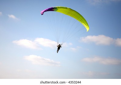paraglider in the blue sky