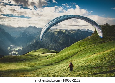 Paraglider in the mountains. Paragliding in the Dolomites. Paragliding in the Alpes