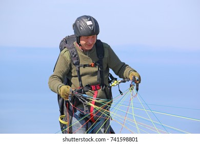 paraglider preparing to launch