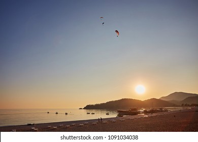 Paraglider Silhouette Flying Over Misty Mountain Valley In Beautiful Warm Sunset Colors - Sport, Active Wallpapers Full Of Freedom. Background With Space For Your Montage