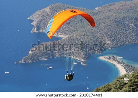 Paragliding enthusiasts jumping from the world famous Babadağ to Ölüdeniz