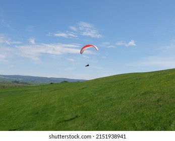 paragliding free flying and powered paragliding across mountains aerial panorama view action sports, extreme sport  