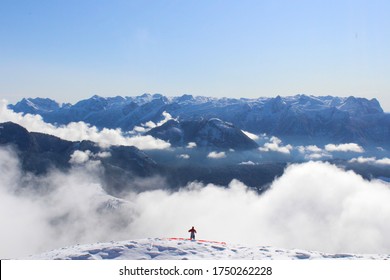 Paragliding At The Top Of The Cloudy Snowy Mountian