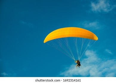 Paragliding, Yellow Parapente On The Blue Sky