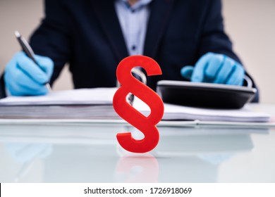 Paragraph Sign At Lawyer Desk Writing Report In Gloves