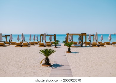 Paralia Platis Gialos Beach Mykonos, Petinos Beach Mikonos Island Greece, Luxury Beach Bed Chairs, And Blue Ocean. Mykonos Greece April 2018