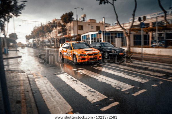 Paralimni, CY - FEB 17, 2019:
Mitsubishi Lancer Evolution rally car ride fast at the city
street