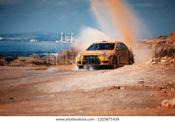 Paralimni, CY - FEB 17, 2019: Mitsubishi Lancer\
Evolution X ride fast on dirt\
road