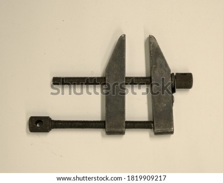 A parallel clamp sometimes called a toolmakers clamp used for precision clamping of metal parts during machining processes