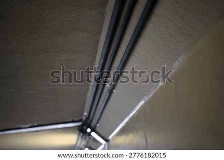 Parallel electrical conduits on ceiling
