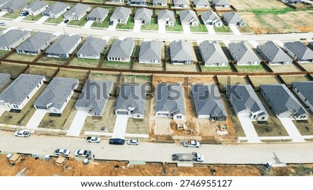 Parallel home progression rows at Highpointe Ranch by US-377, Blackjack Rd finished houses by active builds corridor. Uniform roofs, fresh sod, disturbed soil, alternating residential, Aubrey, TX. USA