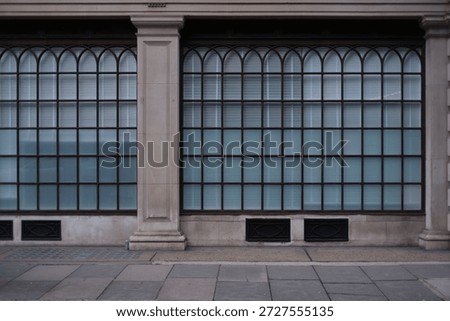Parallel lines of windows panes on modern building on london street