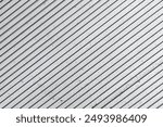 Parallel stripes pattern. Evenly spaced gray lines. Grainy, grunge, and industrial texture. Modern background. Diagonal stripes. Striped texture.