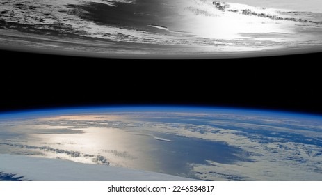 A parallel view of two worlds, one black and white and the other colorful."Elements of this Image Furnished by NASA"