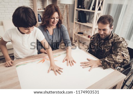 Paralyzed Soldiers's Family Relax. Palms Drawing. Resting Together. Child And Wife. Camouflage Uniform. Feelings Showing. Home Leisure. Disabled Veteran. Watercolor Painting. Smiling People.