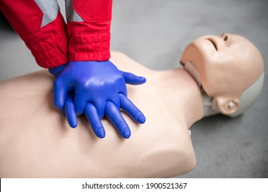 Paramedic Practicing Basic Life Support And Cpr On A Mannequin