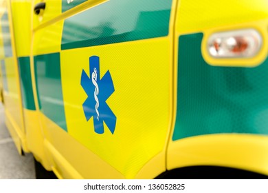 Paramedic Symbol On Yellow Ambulance Car