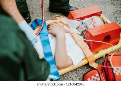 Paramedic team rescuing a young critical patient - Powered by Shutterstock