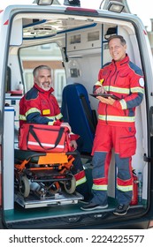 Paramedical Staff Posing For The Camera In The EMS Vehicle