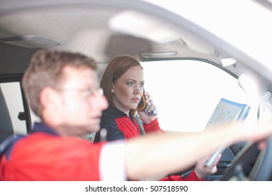 Paramedics In Ambulance Driving To Emergency