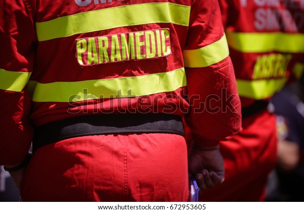 Paramedics rescue\
the victim of a drill car\
crash