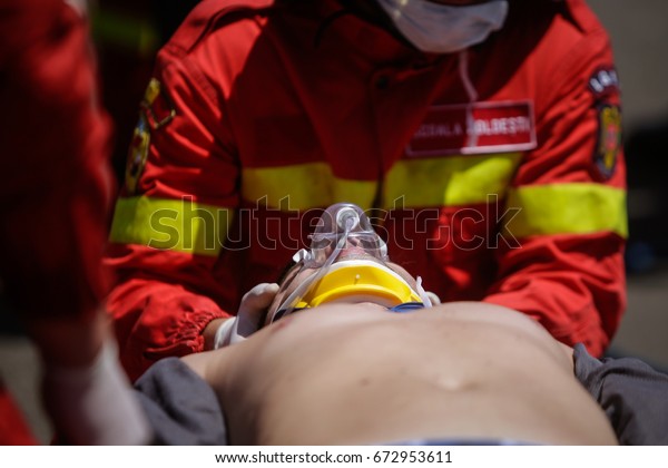 Paramedics rescue\
the victim of a drill car\
crash