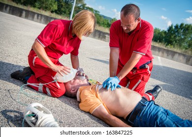 Paramedics succor a man with heart attack - Stock Image - Shutterstock ID 163847225