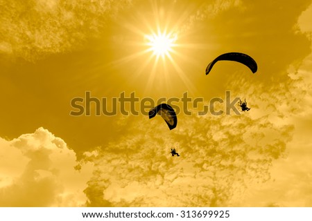 Paramotor flying in the sky,Silhouette