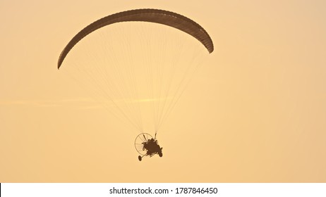 Paramotor Tandem Gliding And Flying In The Air. Copy Space. High Quality Photo