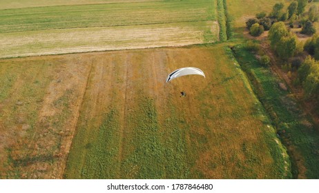 Paramotor Tandem Gliding And Flying In The Air. Copy Space. High Quality Photo