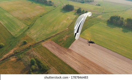 Paramotor Tandem Gliding And Flying In The Air. Copy Space. High Quality Photo