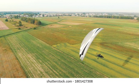 Paramotor Tandem Gliding And Flying In The Air. Copy space.