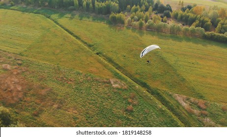 Paramotor Tandem Gliding And Flying In The Air. Copy Space. High Quality Photo