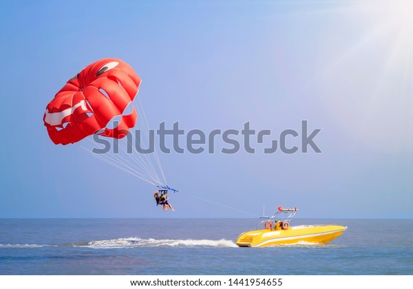 Parasailing - active form of\
recreation, in which a person is fixed with a long rope to a moving\
boat and thanks to presence of special parachute hovers through the\
air