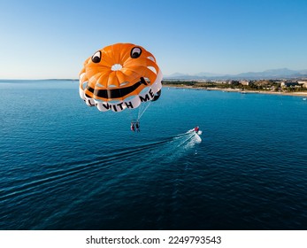 Parasailing in the clear blue sea at a luxury hotel resort, the ultimate vacation experience