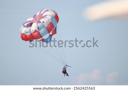 Parasailing couple over the ocean